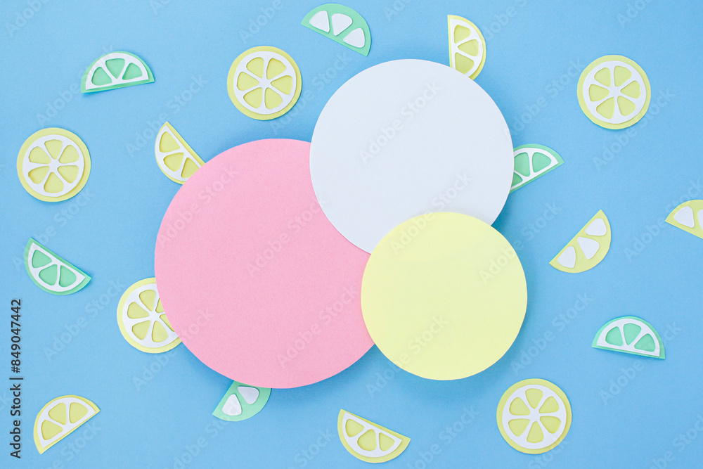 Summer background with circles blue, yellow, pink colors. Lemon slices and circles are cut out of paper. Summer space Summer background with circles blue, yellow, pink colors. Lemon slices and circles are cut out of paper. Summer space