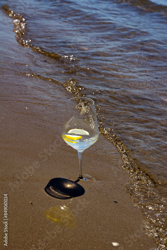 Durres,Albania,May 30,2024:a glass full of Hendrick's on the beach photo