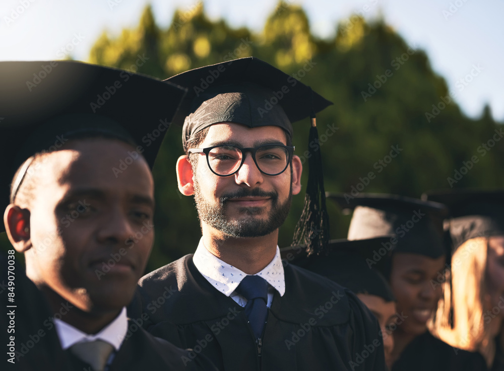 Obraz premium Celebration, graduation and portrait of student man outdoor on campus with friends for ceremony or event. Education, face and smile with happy graduate person at college or university for success
