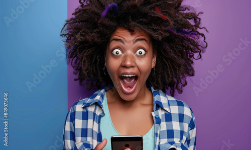 A young excited woman holdi...