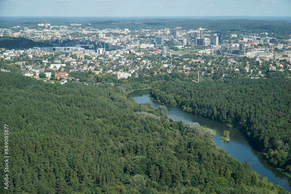 Fototapeta premium Vilija River and residential buildings in Vilnius, Lithuania