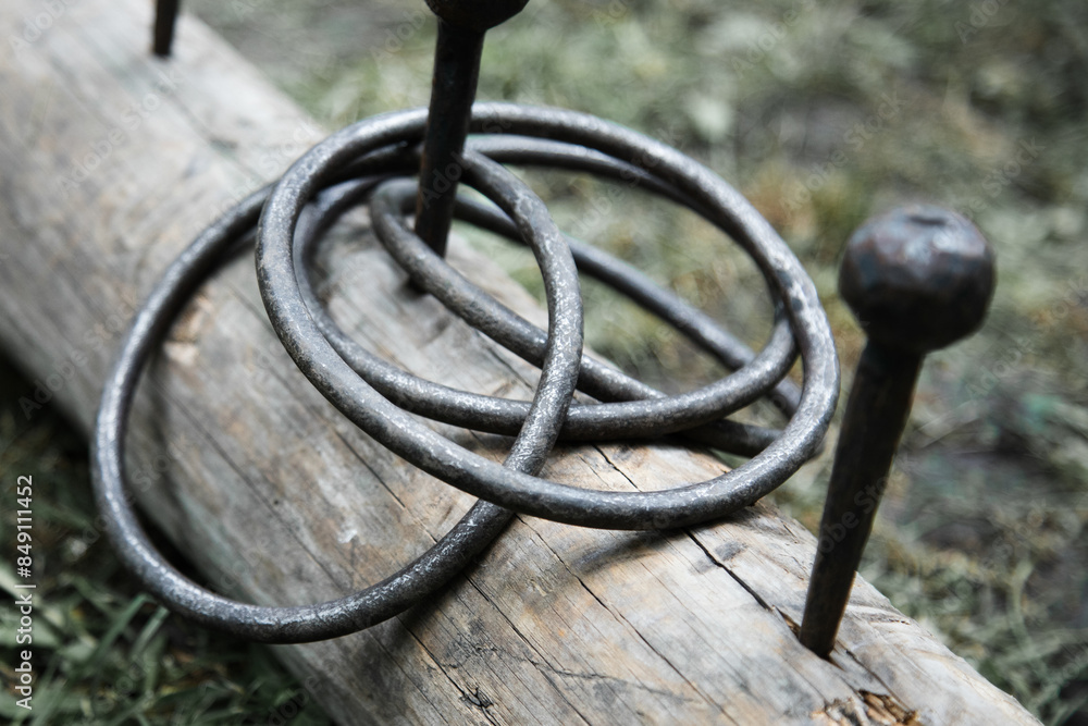 Metal ring toss set on a grass. Close up view Metal ring toss set on a grass. Close up view