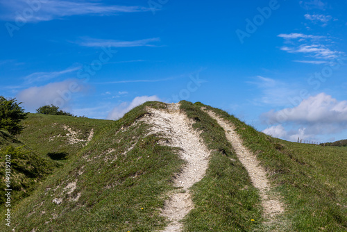 Chalk downland on Ditchling Beacon in Sussex, with a blue sky overhead photo