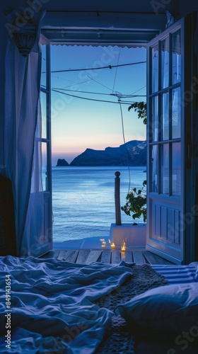 A bedroom with a view of a body of water © Maria Starus