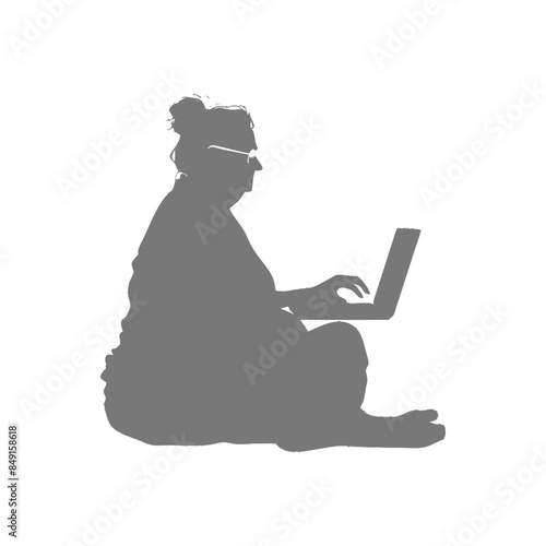 Silhouette of Senior Woman Sitting Cross-Legged Typing on Laptop.