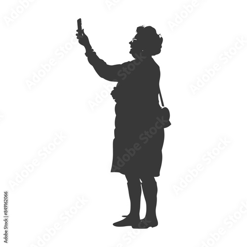 Silhouette: Senior Woman Taking Cell Phone Photo, Purse Over Shoulder.