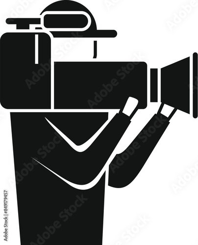 Silhouette of a cameraman holding a big video camera, filming an event