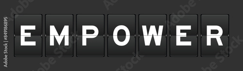 Black color analog flip board with word empower on gray background