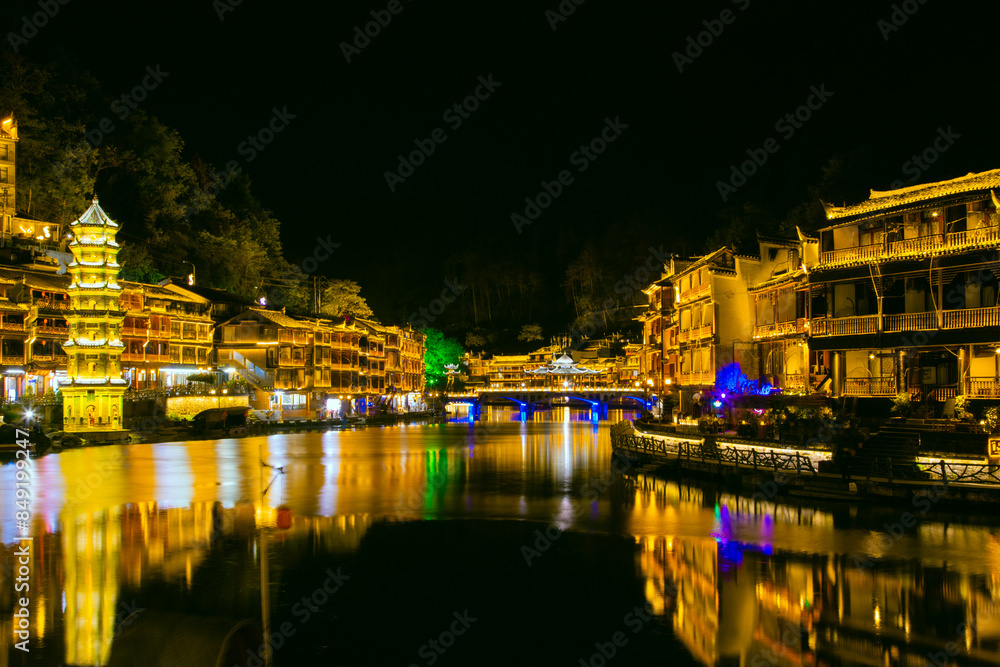 Fototapeta premium Phoenix Ancient Town, Xiangxi, Hunan Province - panoramic night view of the city scenery