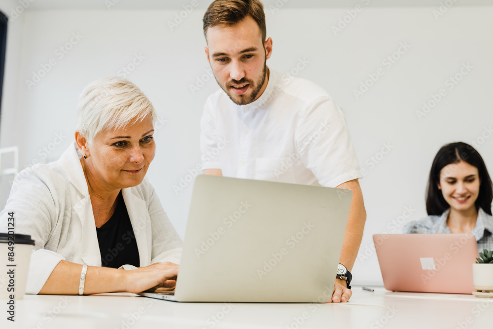 Diverse business team having a meeting in a creative workplace Diverse business team having a meeting in a creative workplace