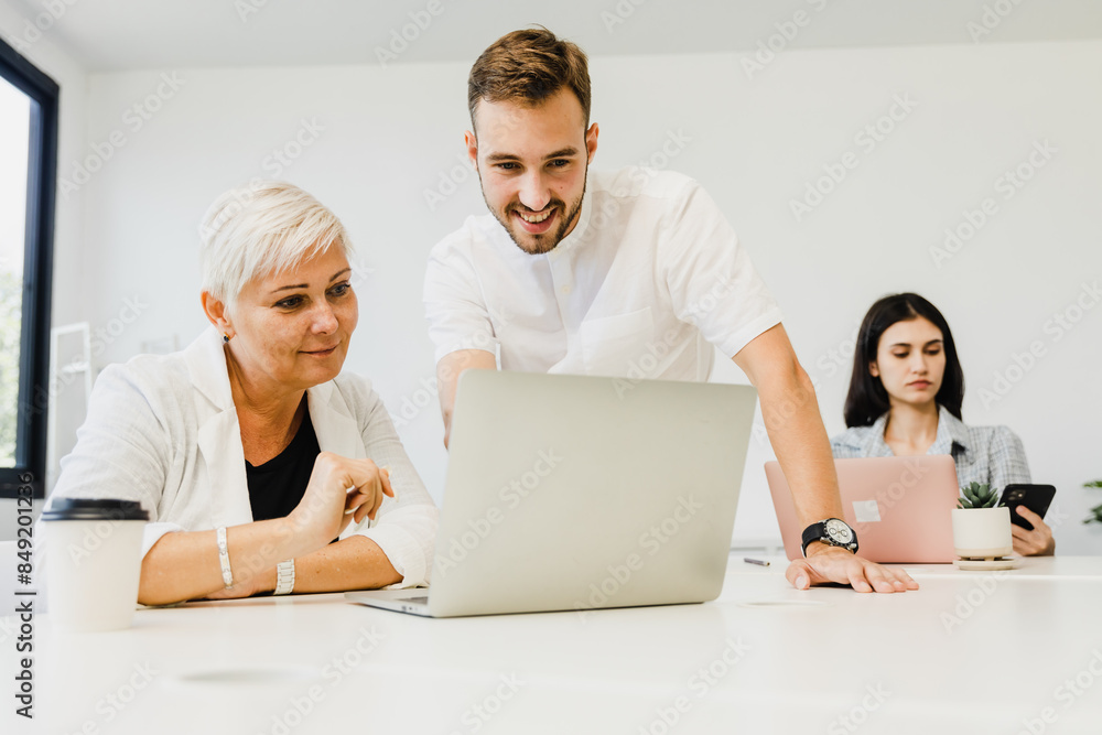 Diverse business team having a meeting in a creative workplace Diverse business team having a meeting in a creative workplace