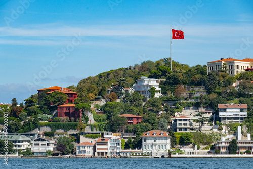 Istanbul Bosporus bridge view in the neighborhood of Usküdar with beautiful buildings in green scenery photo