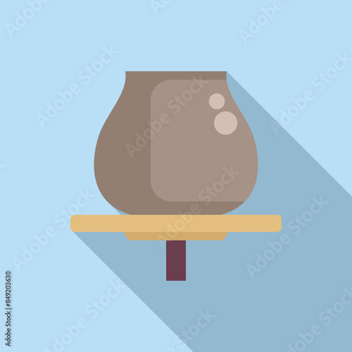 Clay pot standing on wooden turntable in pottery workshop, pottery wheel