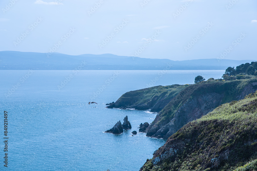 Fototapeta premium Dublin, Ireland - seaside under blue sky and white clouds