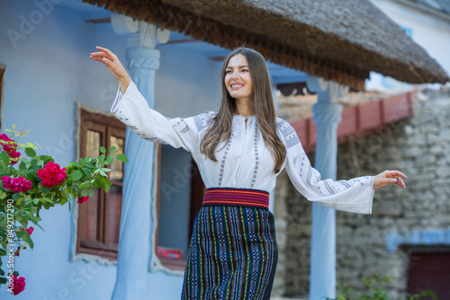 Beautiful traditional costume from Republic of Moldova. Young girl wearing Romanian traditional blouse.