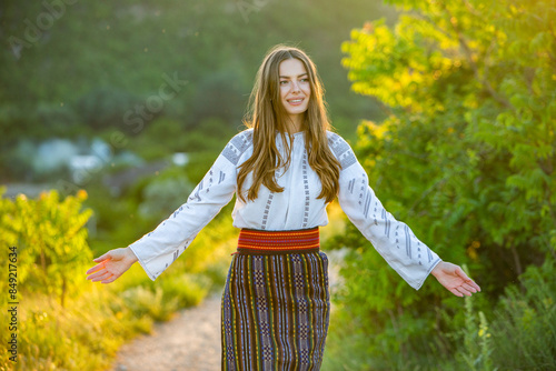 Beautiful traditional costume from Republic of Moldova. Young girl wearing Romanian traditional blouse. photo