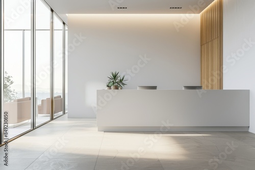 A light-filled office room with a white reception desk and coworking space, as well as a window