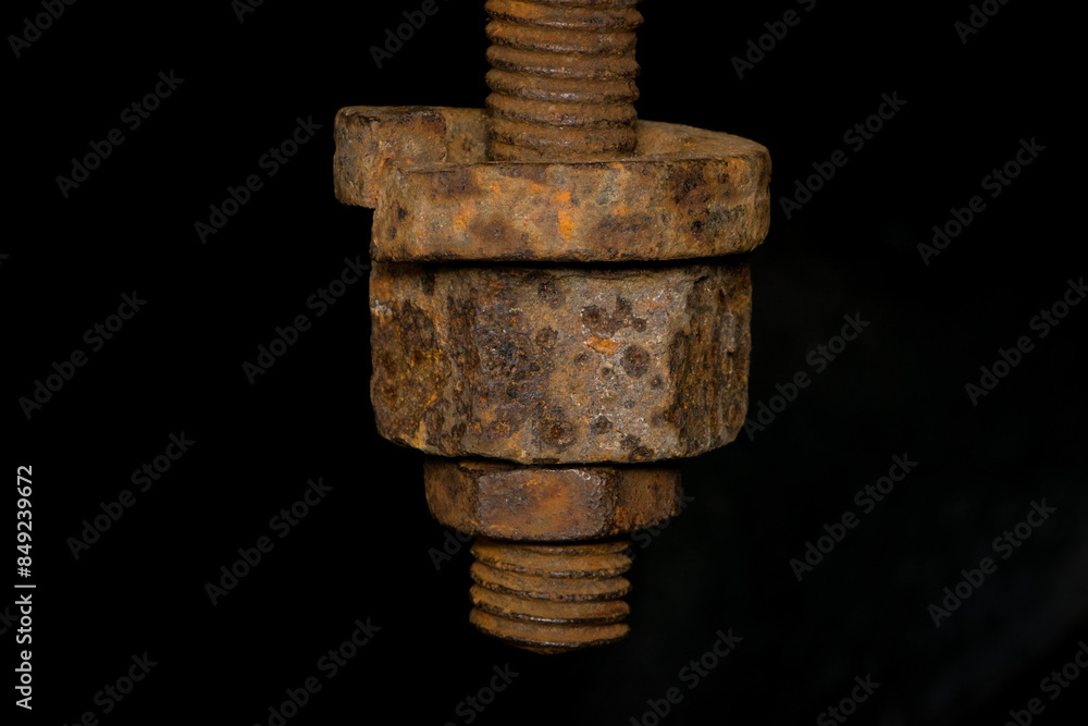 rusty nut. Rusty iron rod with screw threads. Rusted mechanical components. threaded bolt and nut isolated close up. dismantling concept, difficult to unscrew, non-removable. rusty nut. Rusty iron rod with screw threads. Rusted mechanical components. threaded bolt and nut isolated close up. dismantling concept, difficult to unscrew, non-removable.