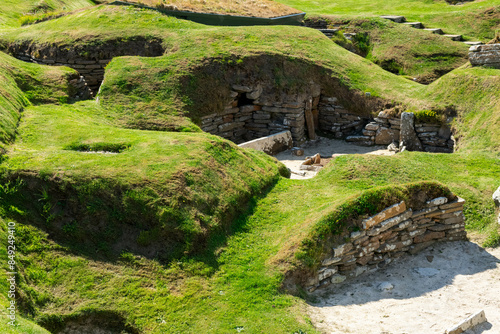 Skara Brae Scotland neolithic site ona  sunny day from Kirkwall port, stone building from ancient times