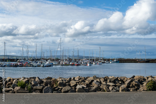 Scotland Kirkwall marina full of yachts with a lighthouse on an overcast afternoon 