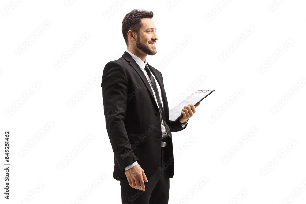 Elegant man in a black suit holding a clipboard Elegant man in a black suit holding a clipboard