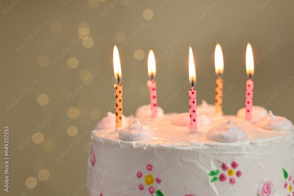 Tasty Birthday cake with burning candles against blurred background, closeup Tasty Birthday cake with burning candles against blurred background, closeup