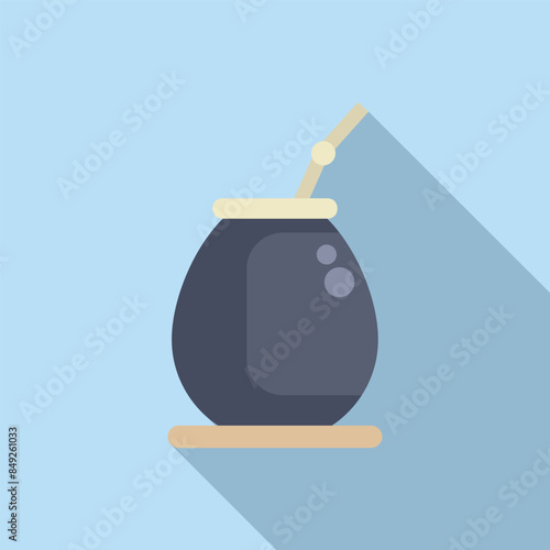 Calabash with bombilla standing on wooden coaster, traditional south american caffeine rich infused drink