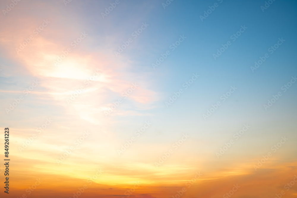 Obraz premium Beautiful , luxury soft gradient orange gold clouds and sunlight on the blue sky perfect for the background, take in everning,Twilight, Large size, high definition landscape photo