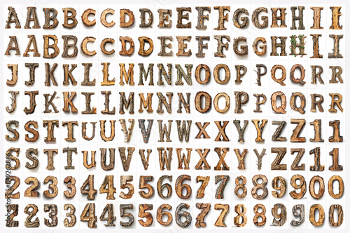 comprehensive set of alphabet letters and numbers crafted in a realistic wood texture, displayed in rows against a white background