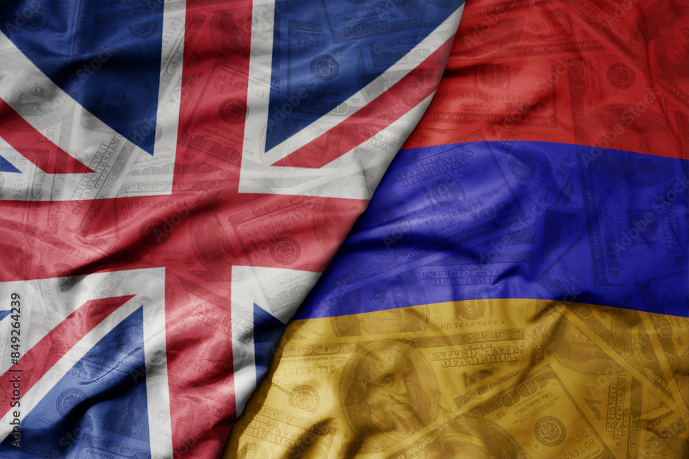 big waving colorful flag of armenia and national flag of great britain on the dollar money background. finance concept.