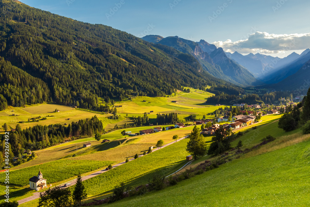 Obraz premium Mountain valley during sunset. Gschnitztal valley near the village of Trins, Tyrol, Austrian Alps, Austria.