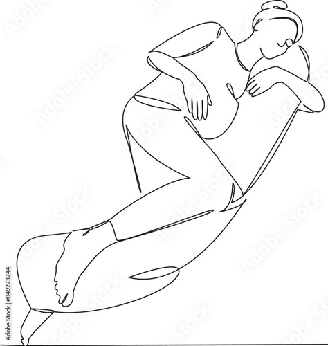 pregnant woman on maternity pillow