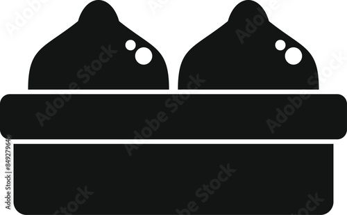 Black silhouette of two round loaves of sourdough bread rising in a proving basket