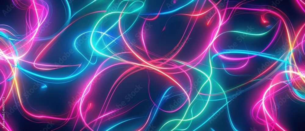 Obraz premium Vibrant abstract neon light trails creating a dynamic and colorful background with twisting and swirling patterns.