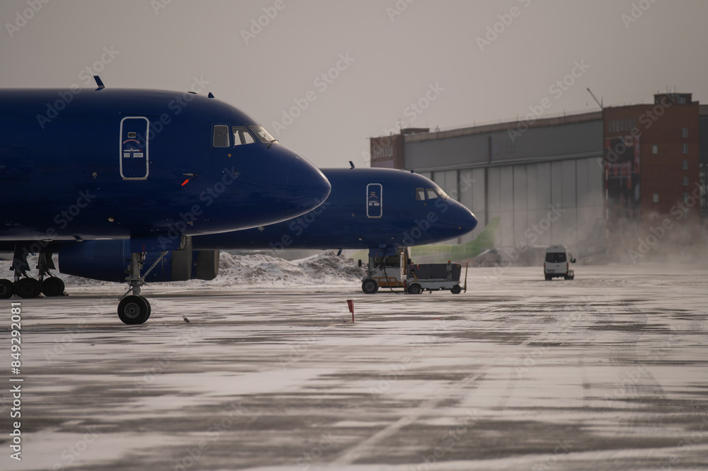 Obraz premium Parked airplane at the airport in winter. 