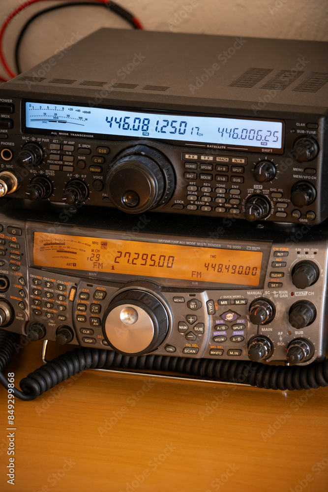 Fototapeta premium Two radio receivers stacked on top of each other.