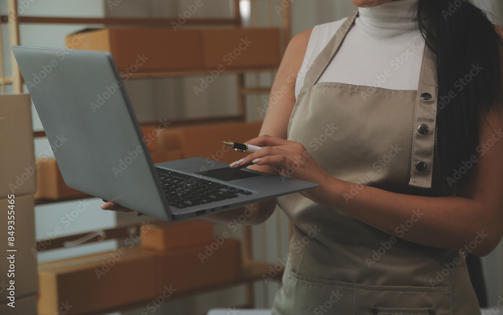 Fototapeta premium Portrait of young business asian woman online working in office desk use computer copyspace. Success business people employee, freelance SME online marketing work at home, coworking space concept