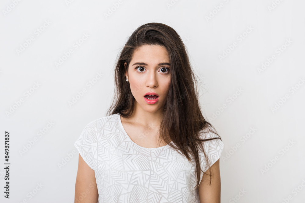 portrait of attractive woman with shocked expression of face, close-up, wide opened eyes and mouth, emotional, isolated on white background portrait of attractive woman with shocked expression of face, close-up, wide opened eyes and mouth, emotional, isolated on white background