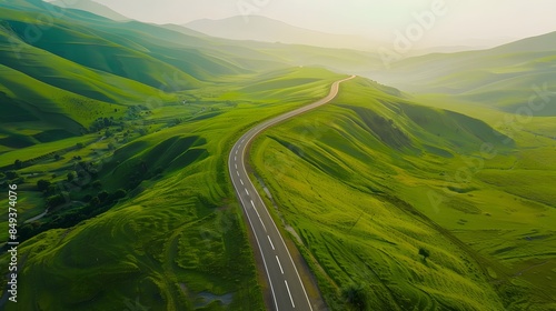 A long road in the middle of a green valley