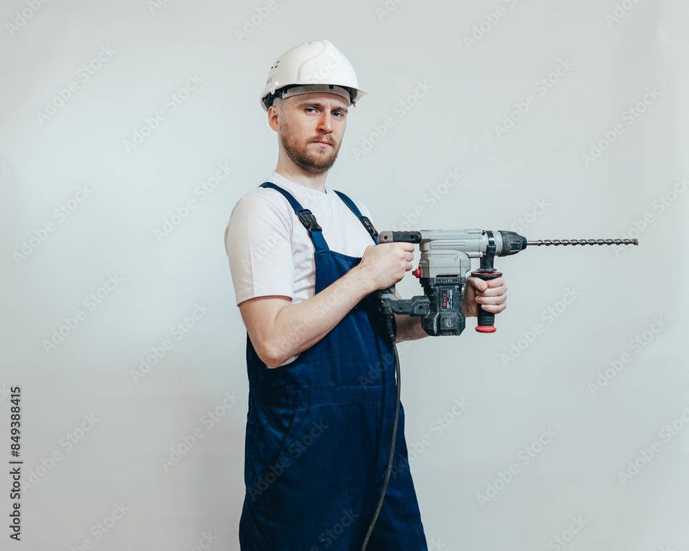worker with drill side view worker with drill side view