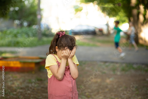 Canvastavla Upset lonely bullied little kid girl cries covering his eyes with his hands feel