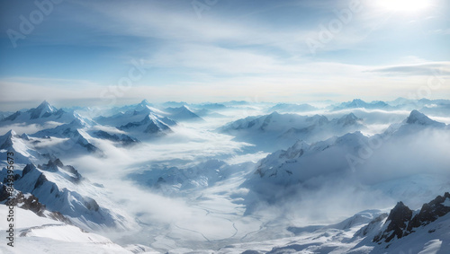 a mountain range covered in snow and clouds