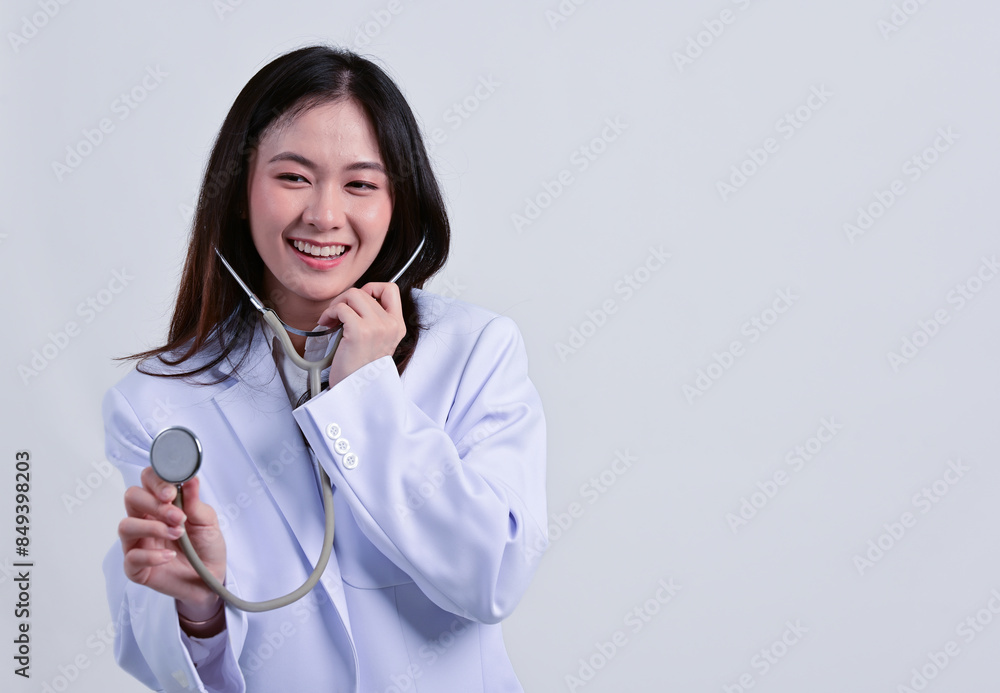The beautiful Asian female doctor in uniform at hospital. The beautiful Asian female doctor in uniform at hospital.