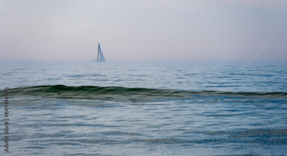sailboat on wavy Baltic sea on Hel peninsula in Poland