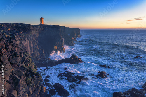 Svortuloft, spelled Svörtuloft in Icelandic, is a 4 kilometer long pitch-black coastal cliff with a bright orange lighthouse situated at the western tip of the Snaefellsnes Peninsula in West Iceland.