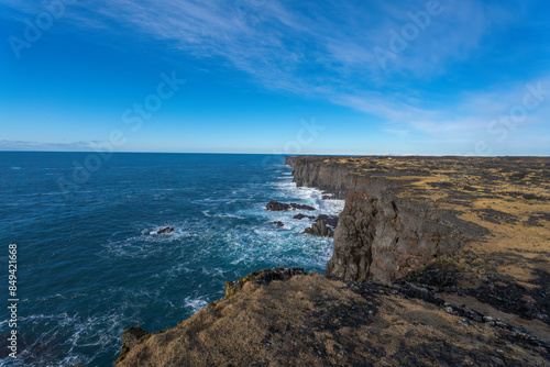 Svortuloft, spelled Svörtuloft in Icelandic, is a 4 kilometer long pitch-black coastal cliff with a bright orange lighthouse situated at the western tip of the Snaefellsnes Peninsula in West Iceland.