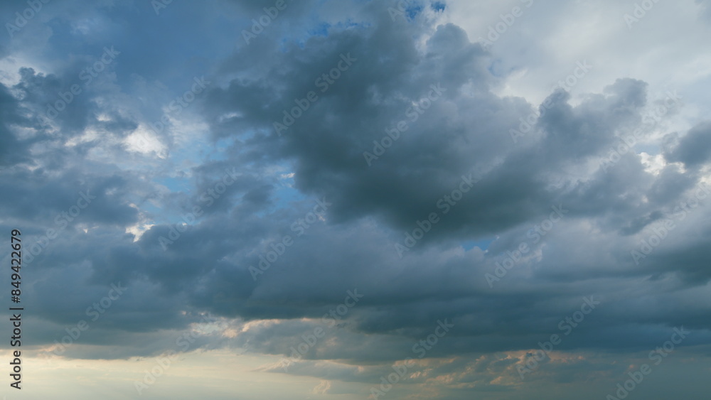 Obraz premium Dramatic dark blue thunderclouds. Dark stormy sky with rainy clouds. Typhoon sky. Timelapse.