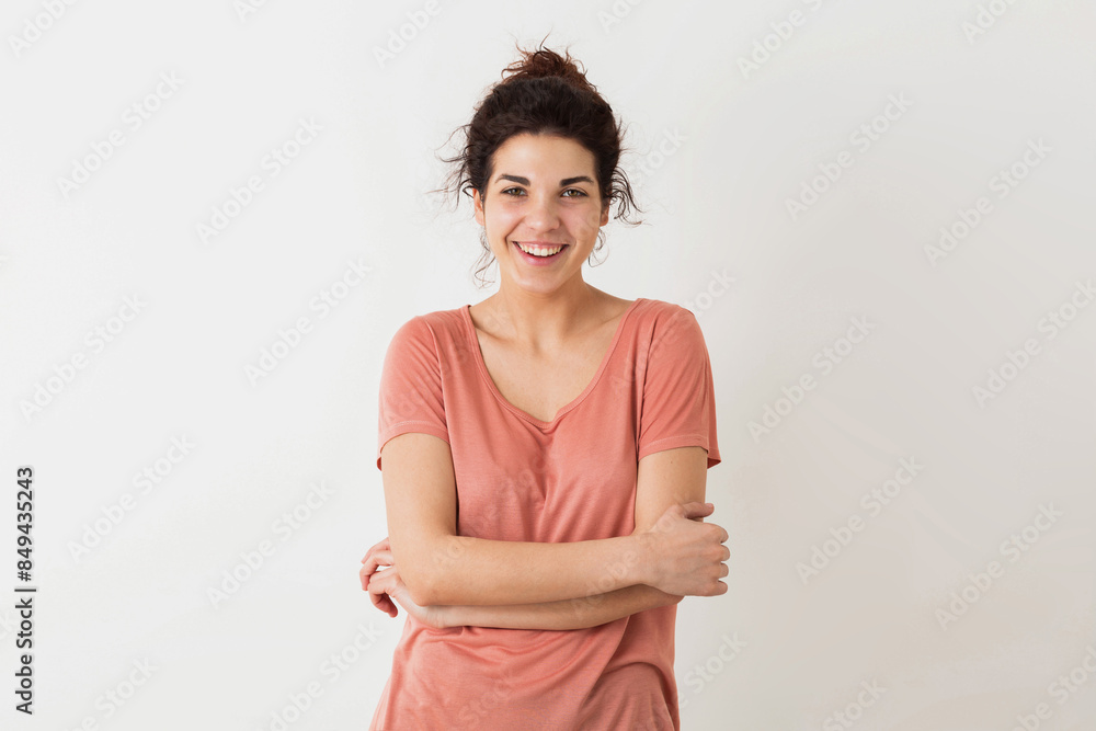 portrait of young natural looking smiling happy hipster pretty woman in pink shirt