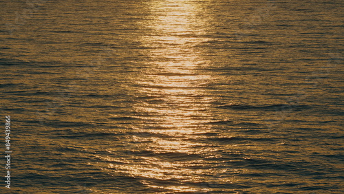 Sun Reflection And Ripples On Sea Water Surface At Sunset. Sea Water Background.