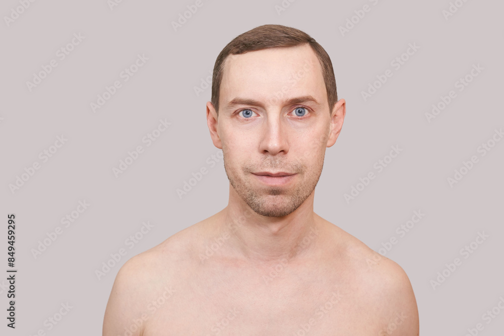 Serious caucasian man. Beauty cosmetology portrait. Calm health relax concept. Opened eyes. Male person. Dream about travel. Clean skin procedure. Handsome adult. Grey background. Serious caucasian man. Beauty cosmetology portrait. Calm health relax concept. Opened eyes. Male person. Dream about travel. Clean skin procedure. Handsome adult. Grey background.